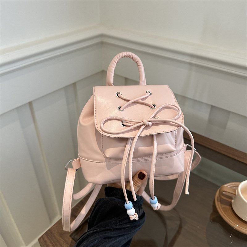 Women's textured drawstring fashion handbag niche design versatile solid color gentle backpack trendy
