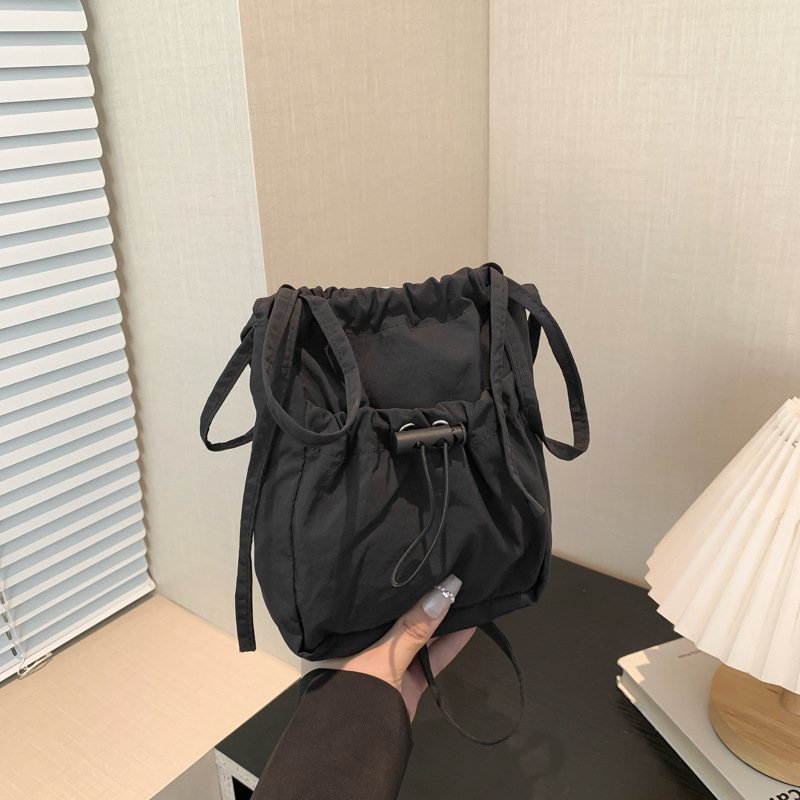 Simple forest style small shoulder bag, lightweight nylon mobile phone bag, lazy pleated drawstring crossbody bag for women