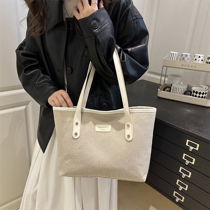 Trendy fashion handheld tote bag, retro simple commuting shoulder bag, personalized casual short-distance women's bag